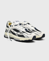 Witte hardloopsneakers met blauw-zwarte panelen, veters en dikke zool