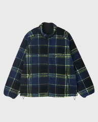 Reversible sherpa jas met donkerblauwe en groen-gele ruit, opstaande kraag en rits