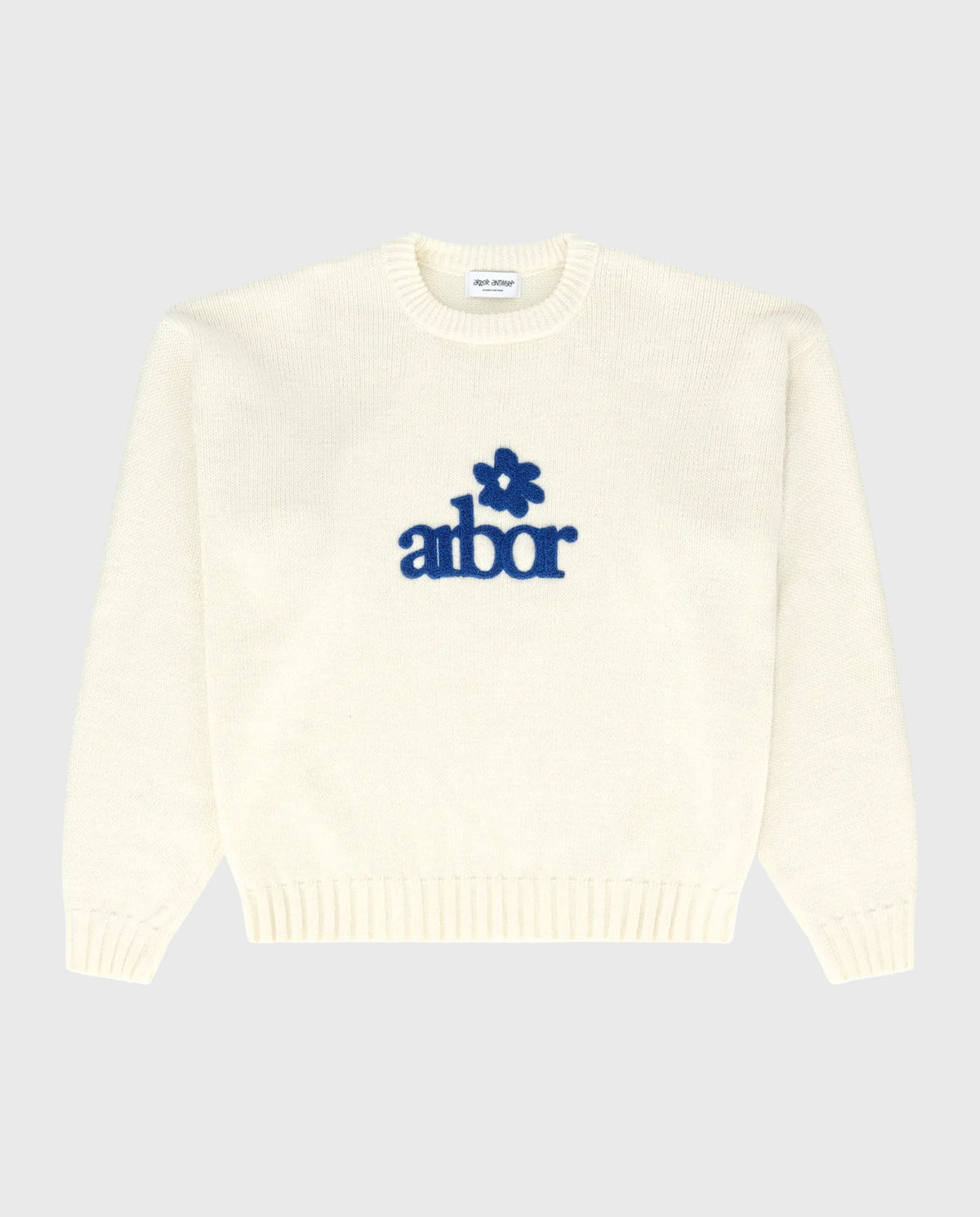 Beige alpaca gebreide trui met blauw 'albor' logo op borst, ronde hals
