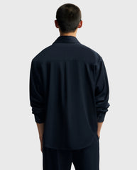 Oversized navy overhemd, achterkant met opstaande kraag en lange mouwen