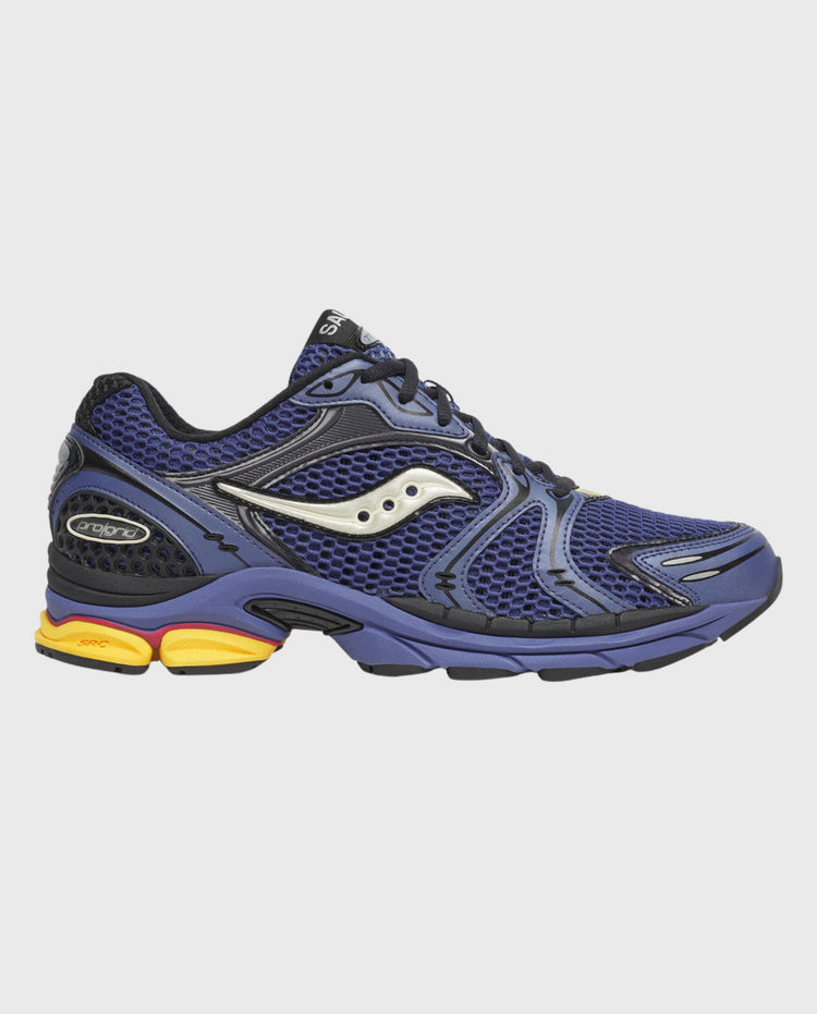 Hardloopschoenen Saucony Progrid Triumph 4, zijkant blauw met lichte inzet en gele zool