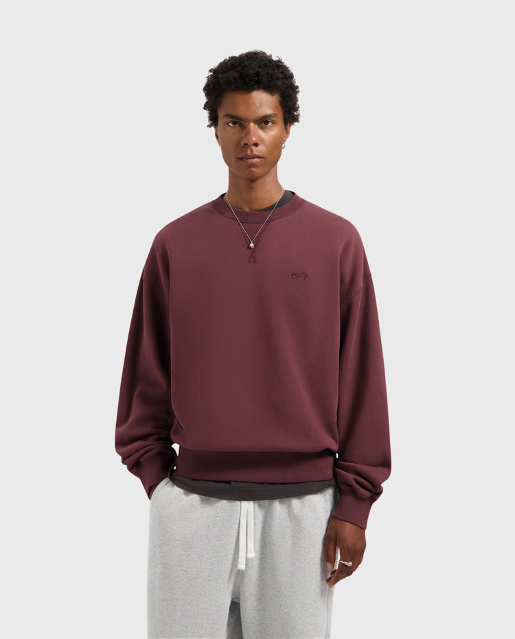 Donkerrode crewneck sweater met geribde boorden en subtiel borstlogo
