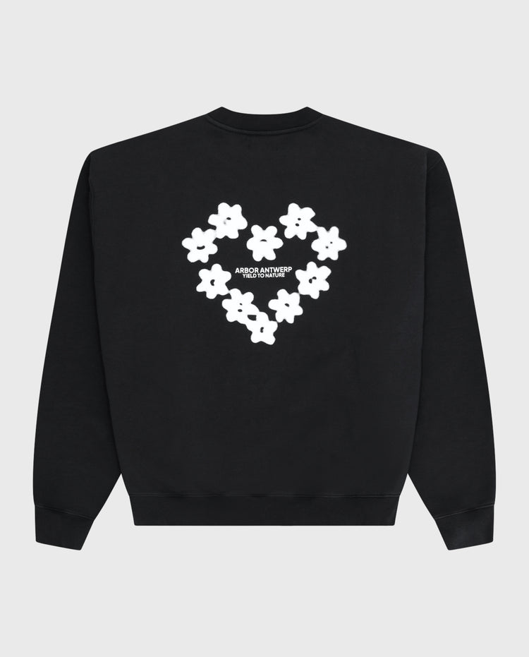 Zwarte crewneck sweater met wit bloemhart-print op de rug