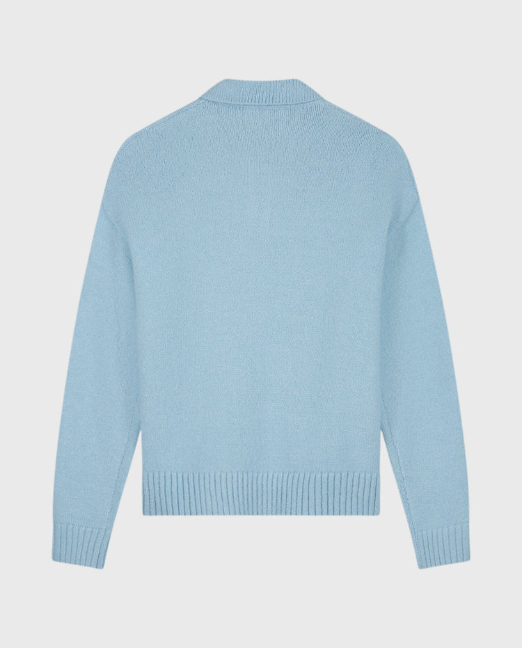 Blauwe oversized gebreide polo met opstaande kraag en knoopsluiting, lange mouwen
