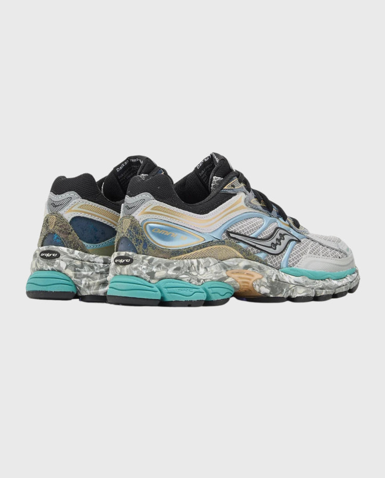Saucony Progrid Omni 9 sneaker zijaanzicht met zwarte hielkap en mintgroene accenten