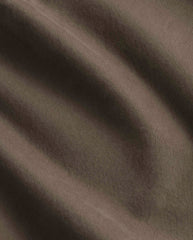 Bruine denimstof in close-up met fijne geweven textuur